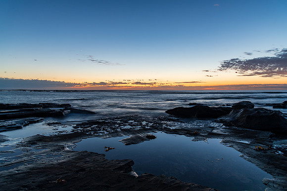 Rocky coastline sunrise seascape