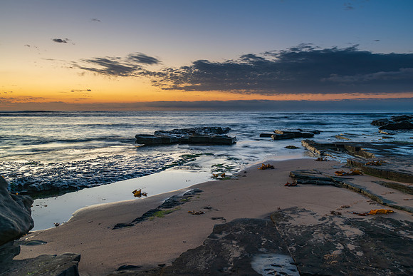 Rocky coastline sunrise seascape