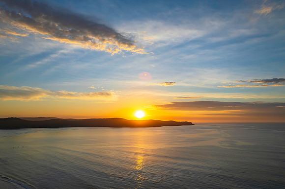 Sunrise seascape with a mix of high and medium clouds