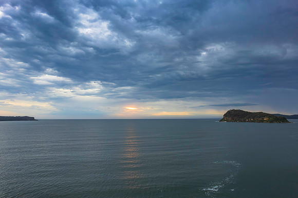 Cloudy sunrise seascape as a storm moves on