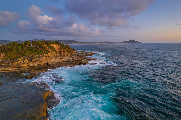 Aerial Sunrise Seascape at Rocky Inlet with clouds
