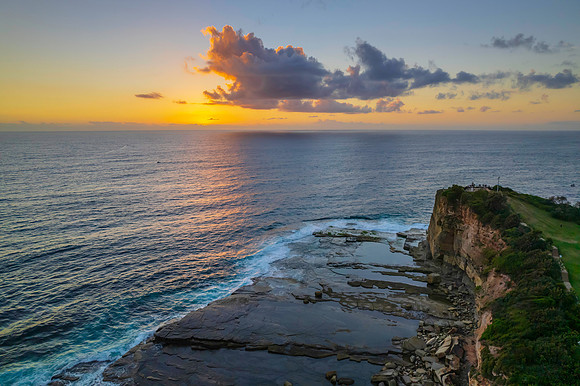 Aerial Sunrise Seascape at Rocky Inlet with clouds