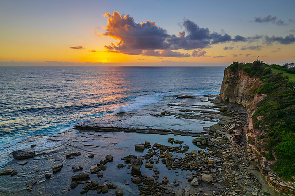 Aerial Sunrise Seascape at Rocky Inlet with clouds
