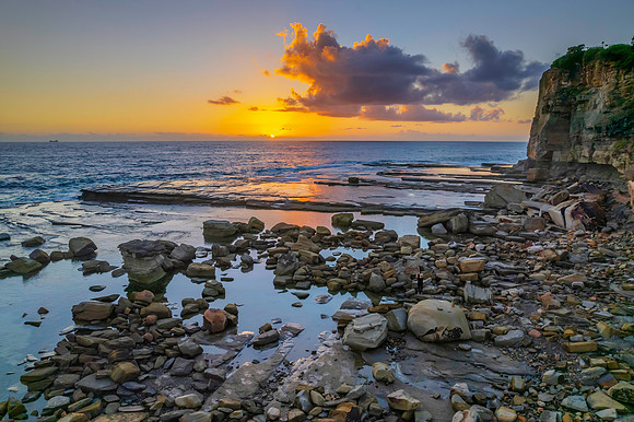 Aerial Sunrise Seascape at Rocky Inlet with clouds