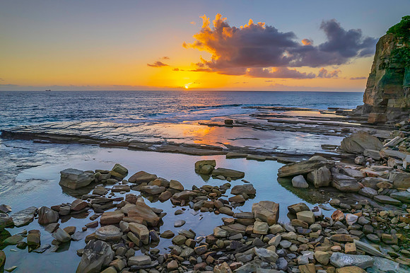 Aerial Sunrise Seascape at Rocky Inlet with clouds