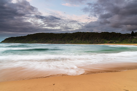 Moody morning bay seascape with rain clouds