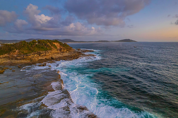 Aerial Sunrise Seascape at Rocky Inlet with clouds