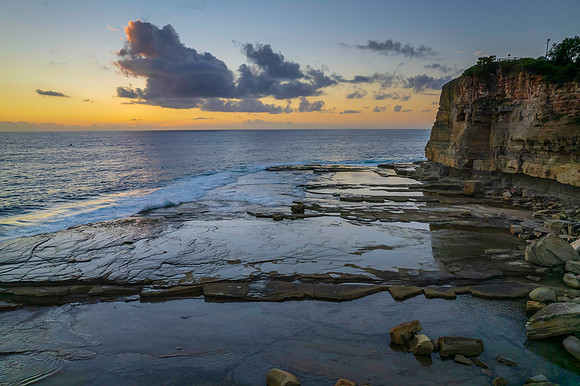 Aerial Sunrise Seascape at Rocky Inlet with clouds