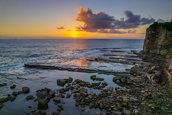 Aerial Sunrise Seascape at Rocky Inlet with clouds