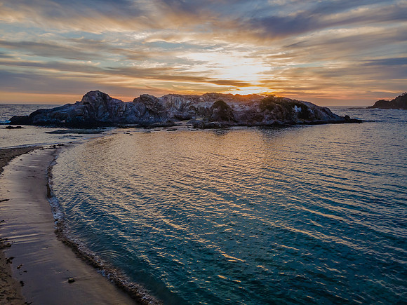 Colourful High Cloud Sunrise Seascape and Rock Formations