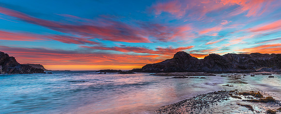 Colourful High Cloud Sunrise Seascape Panorama and Rock Formatio