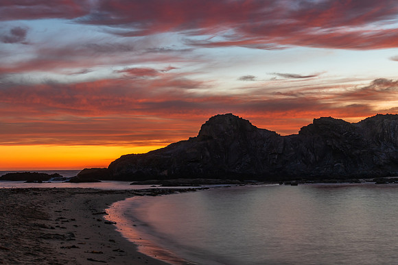 Colourful High Cloud Sunrise Seascape and Rock Formations