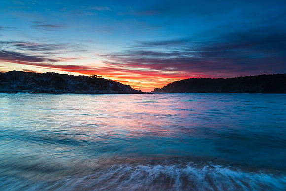 Colourful High Cloud Sunrise Seascape and Rock Formations