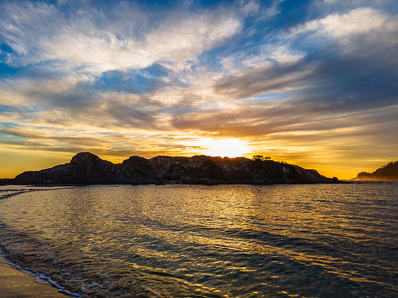 Colourful High Cloud Sunrise Seascape and Rock Formations