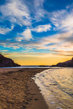 Colourful High Cloud Sunrise Seascape and Rock Formations