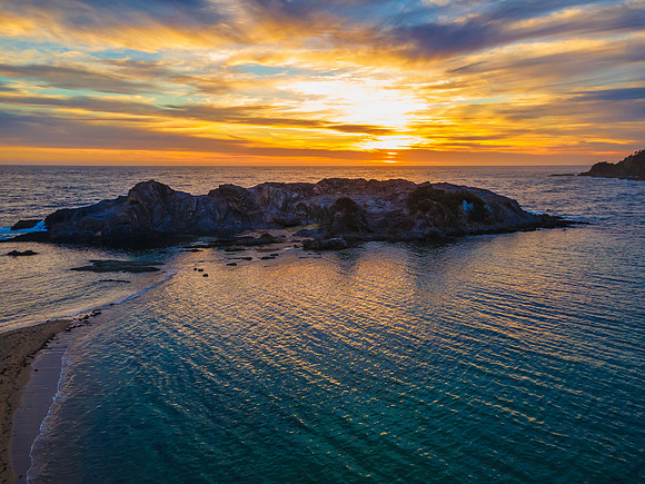 Colourful High Cloud Sunrise Seascape and Rock Formations