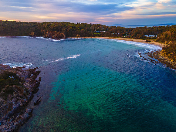 Colourful High Cloud Sunrise Seascape and Rock Formations