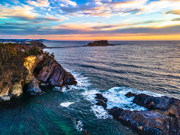 Colourful High Cloud Sunrise Seascape and Rock Formations