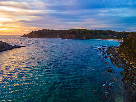 Colourful High Cloud Sunrise Seascape and Rock Formations