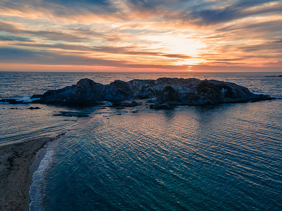 Colourful High Cloud Sunrise Seascape and Rock Formations