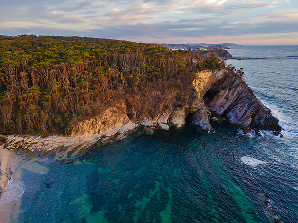 Colourful High Cloud Sunrise Seascape and Rock Formations