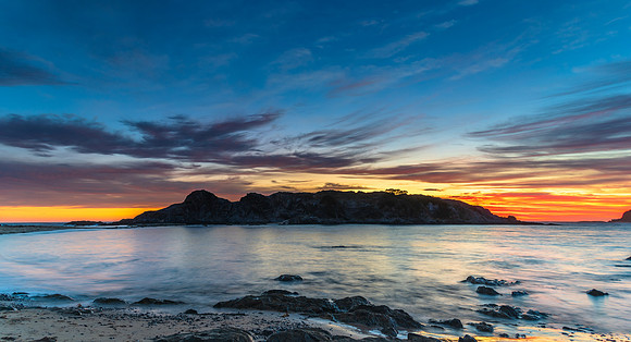 Colourful High Cloud Sunrise Seascape Panorama and Rock Formatio