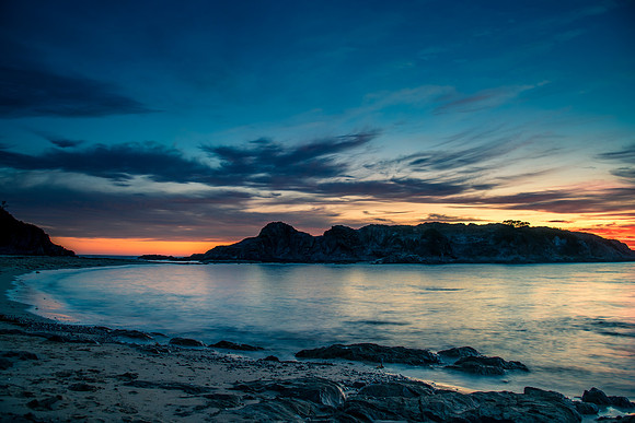 Colourful High Cloud Sunrise Seascape and Rock Formations