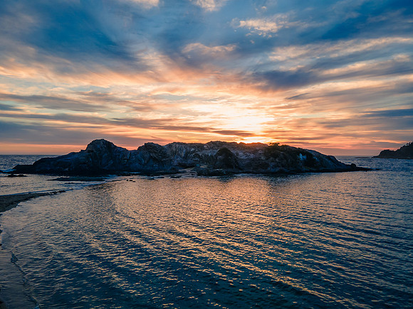 Colourful High Cloud Sunrise Seascape and Rock Formations