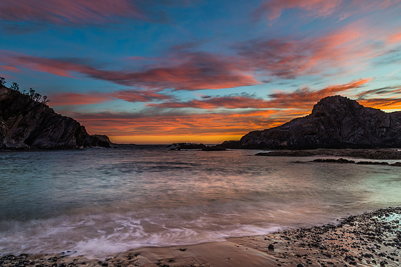 Colourful High Cloud Sunrise Seascape and Rock Formations