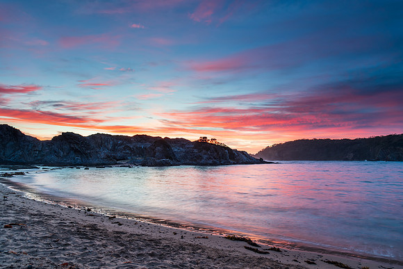 Colourful High Cloud Sunrise Seascape and Rock Formations