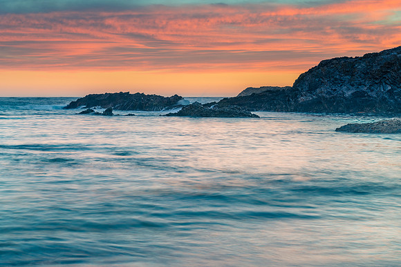 Colourful High Cloud Sunrise Seascape and Rock Formations
