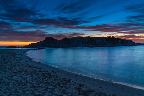 Blue Dawn with Pink Clouds and Rock Formations