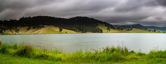 Dam surrounded by hilly countryside