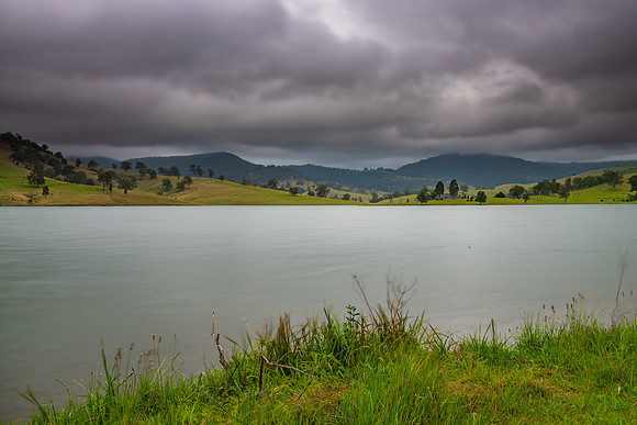 Dam surrounded by hilly countryside