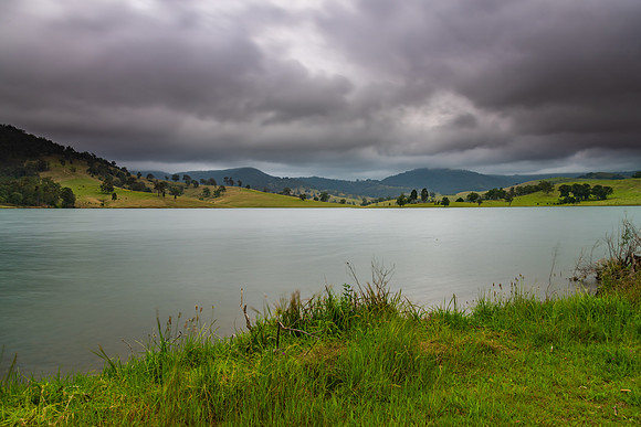 Dam surrounded by hilly countryside