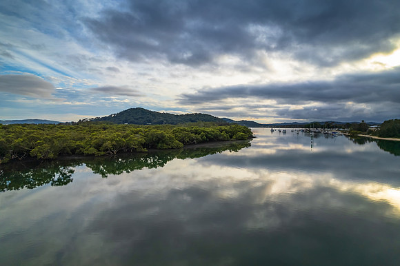 Clouds and reflections early morning waterscape