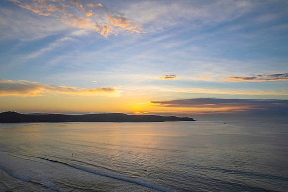 Sunrise seascape with a mix of high and medium clouds
