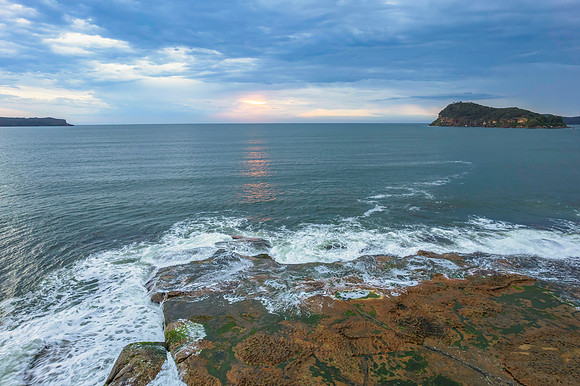 Cloudy sunrise seascape as a storm moves on