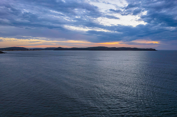 Cloudy sunrise seascape as a storm moves on