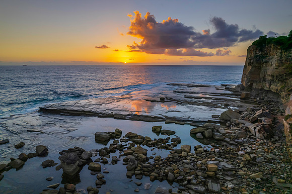 Aerial Sunrise Seascape at Rocky Inlet with clouds