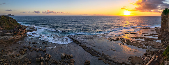 Aerial Sunrise Seascape at Rocky Inlet with clouds
