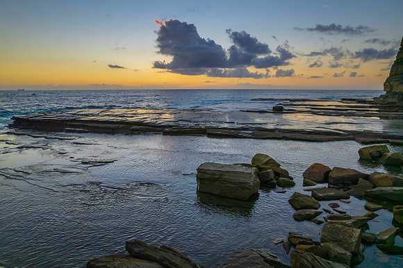 Aerial Sunrise Seascape at Rocky Inlet with clouds