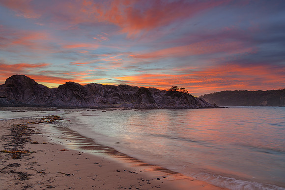Colourful High Cloud Sunrise Seascape and Rock Formations