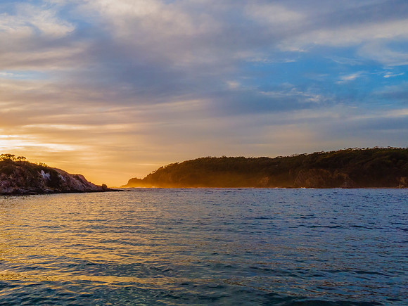 Colourful High Cloud Sunrise Seascape and Rock Formations