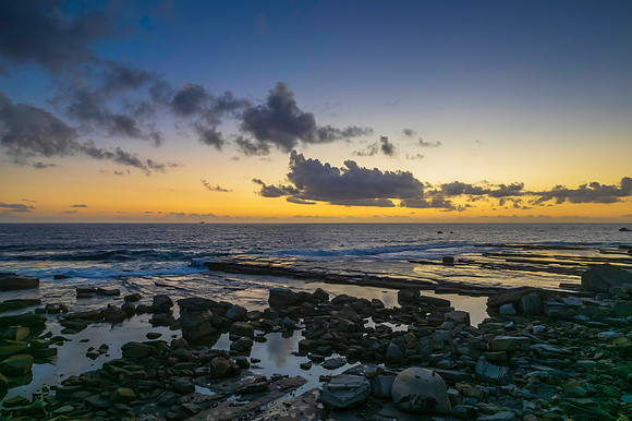 Aerial Sunrise Seascape at Rocky Inlet with clouds