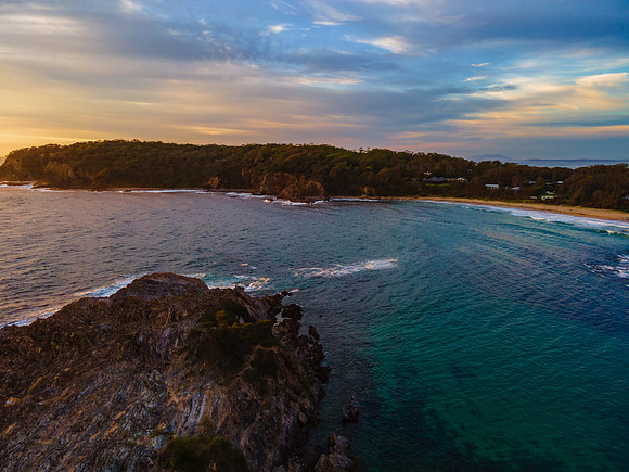 Colourful High Cloud Sunrise Seascape and Rock Formations