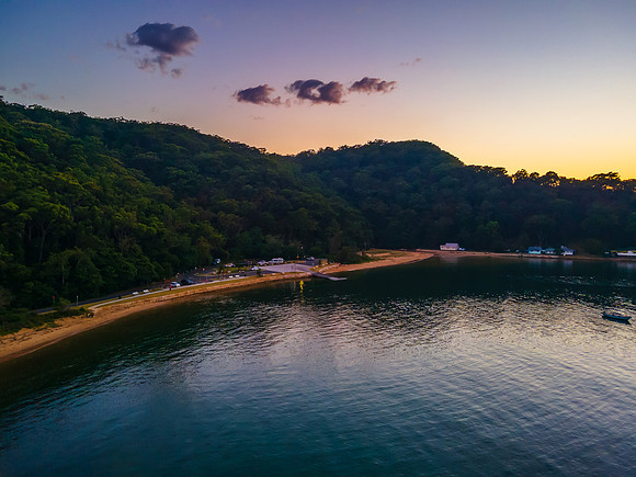 Boats at rest and gentle sunrise over the bay