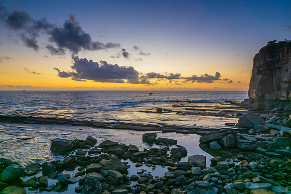 Aerial Sunrise Seascape at Rocky Inlet with clouds
