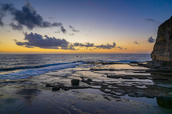 Aerial Sunrise Seascape at Rocky Inlet with clouds