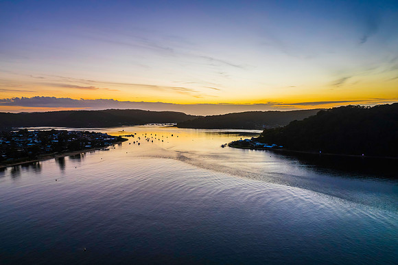 Aerial sunrise waterscape with boats
